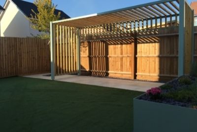 A pergola attached to a wall